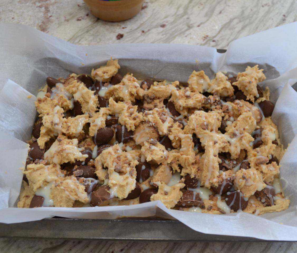 Peanut Butter Candy Bite Cookie Bars are a rich, gooey, treat loaded with peanut butter and bite size pieces of candy.