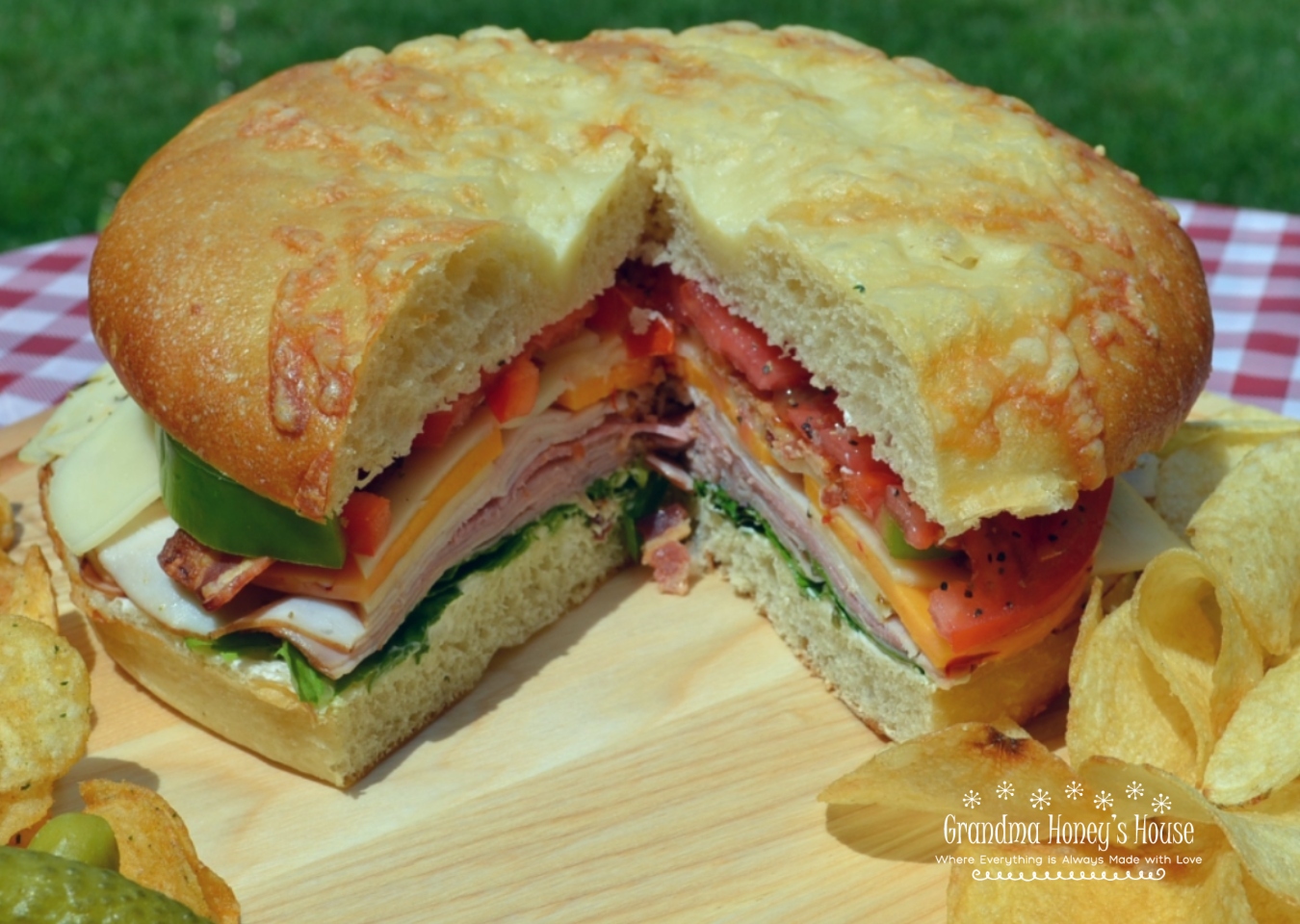 Picnic Foccacia Sandwich is loaded with meats, cheeses,and veggies. Made on a foccia loaf, drizzled with italian dressing and cut into beautiful wedges. 