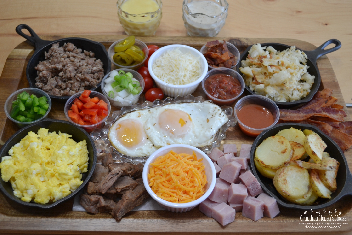 Country Breakfast Bowl Board is loaded with meats,veggies,eggs,toppings,cheeses,and sauces. 