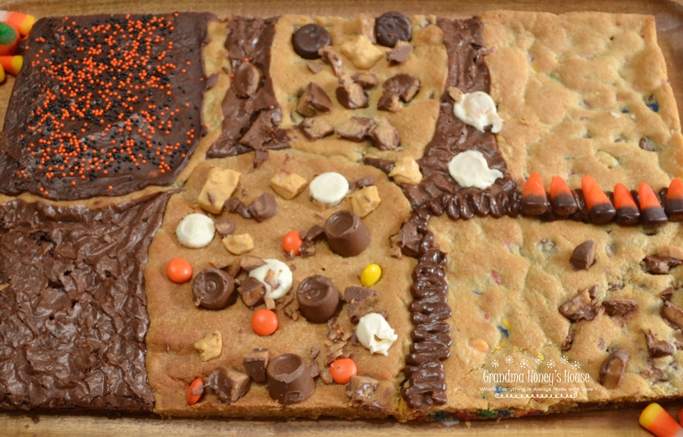 This Halloween Candy Bar Cookie is a mixture of different cookie dough, and brownie mix baked together on a sheet pan. Different candies and chips are added to dough or top the treat.