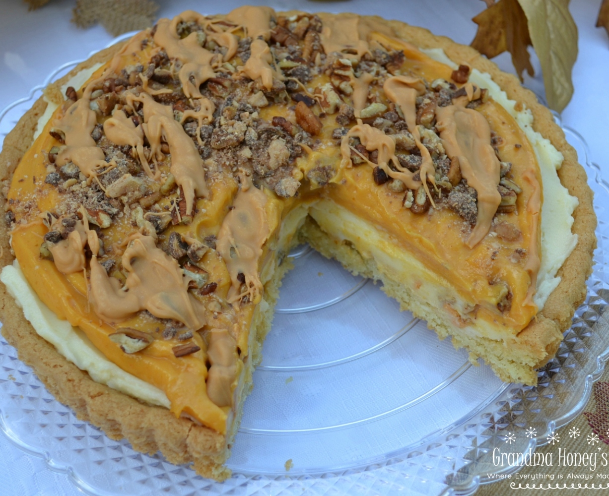 Pumpkin Butterscotch Mascarpone Cookie Tart is a perfect fall dessert with a cookie tart and layers of pumpkin, mascarpone cheese and toppings of toffee bits and butterscotch.