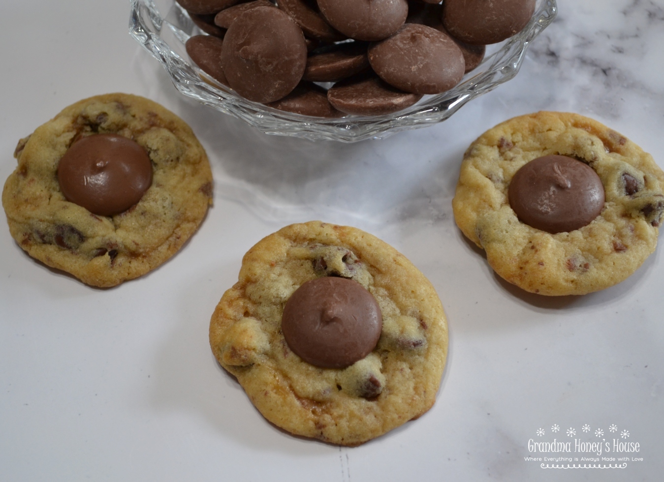 Chocolate Chip Toffee Thumbprint Cookies are a soft cookie loaded with chocolate chips, toffee bits and a Ghirardelli chocolate wafer added to center after baked.