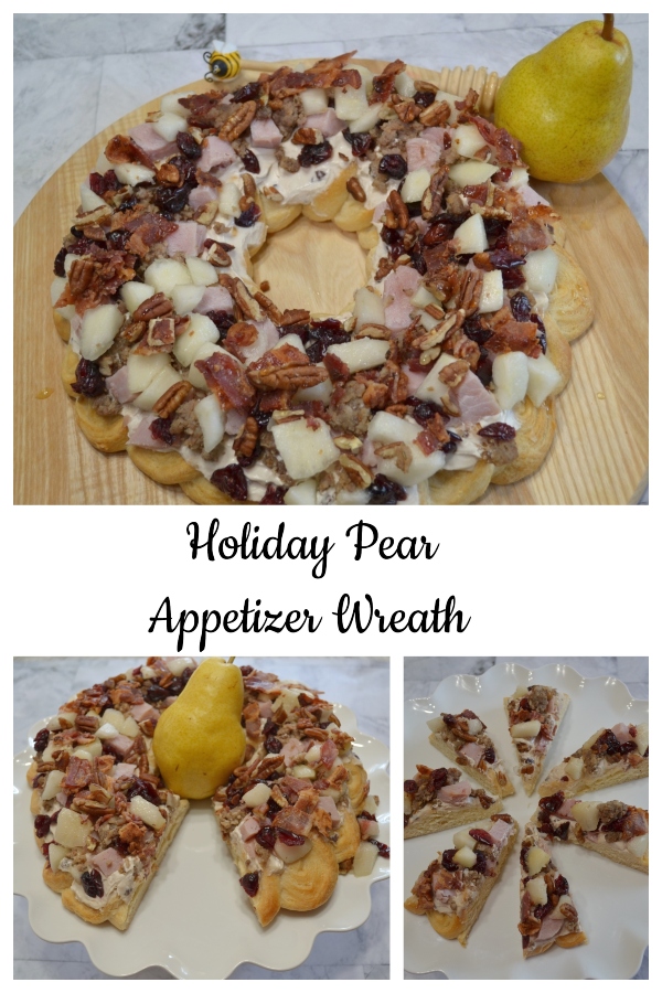 Holiday Pear Appetizer Wreath starts with a crescent crust,honey pecan cream cheese spread and topped with pears,ham,sausage,nuts,bacon,cranberries,and a drizzle of honey