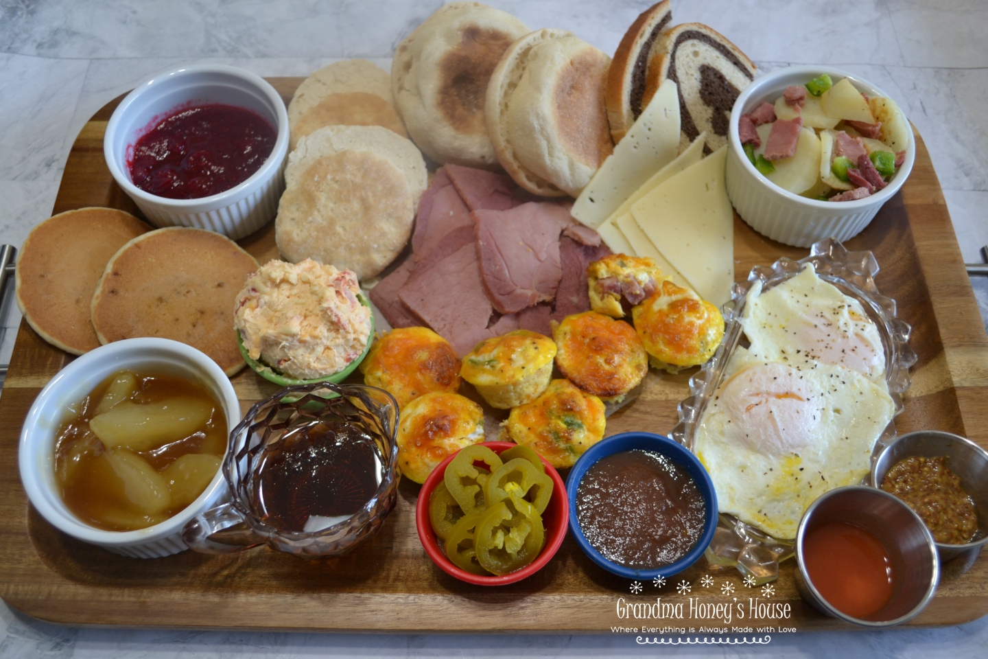 A trendy breakfast board with ingredients chosen to accent the Clifty Farm Country Ham Biscuit Slices