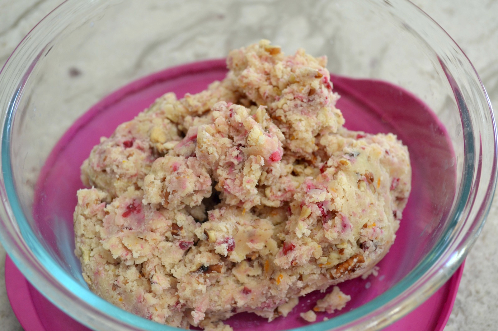 A delicious holiday cookie starting with a snowball recipe and upgraded with frozen  cranberries and orange zest.