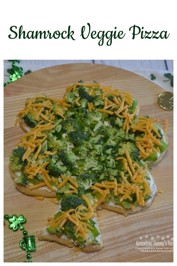 Shamrock Veggie Pizza is an easy appetizer made on a crescent dough crust, cream cheese and ranch filling, topped with green veggies for St Patrick's Day.
