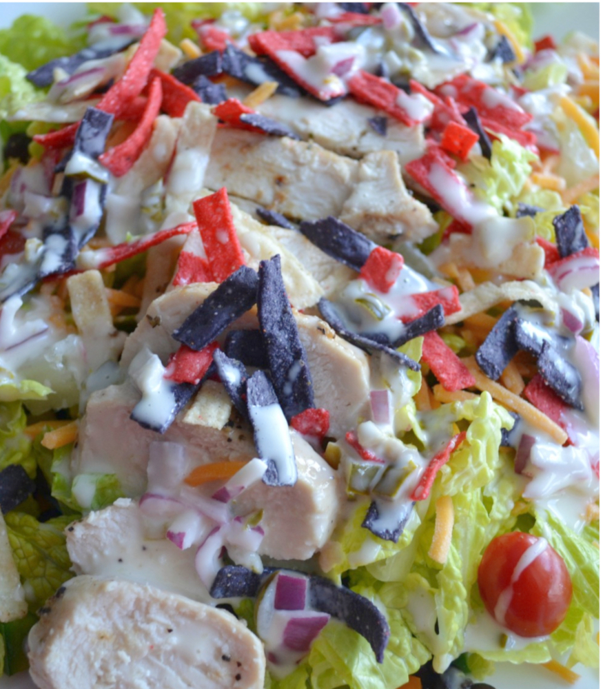 Southwest Chicken Salad is filled with southwest inspired ingredients like black beans, corn, grilled chicken, peppers, tomatoes and topped with a homemade jalapeno dressing.