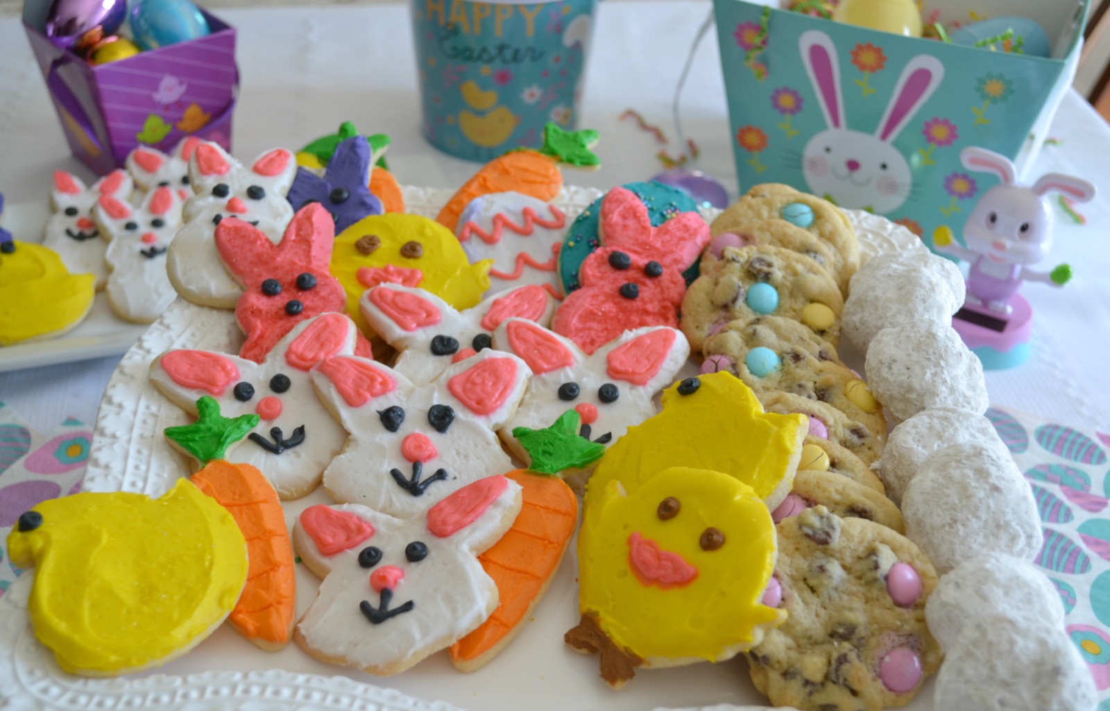 Easter treats to make with your children. Decorated sugar cookies candy bags, cupcakes