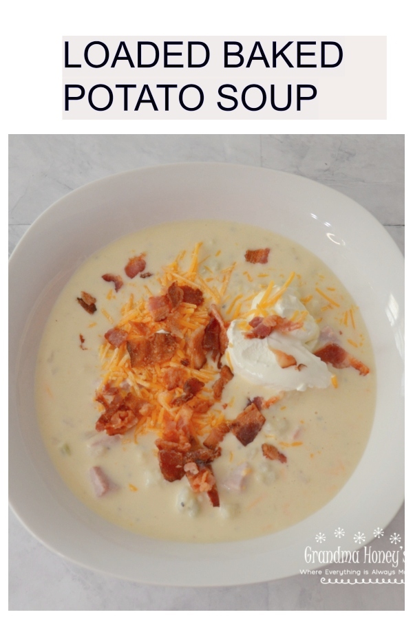 Loaded Baked Potato Soup, a pot full of potatoes, ham, cheese, bacon and veggies.