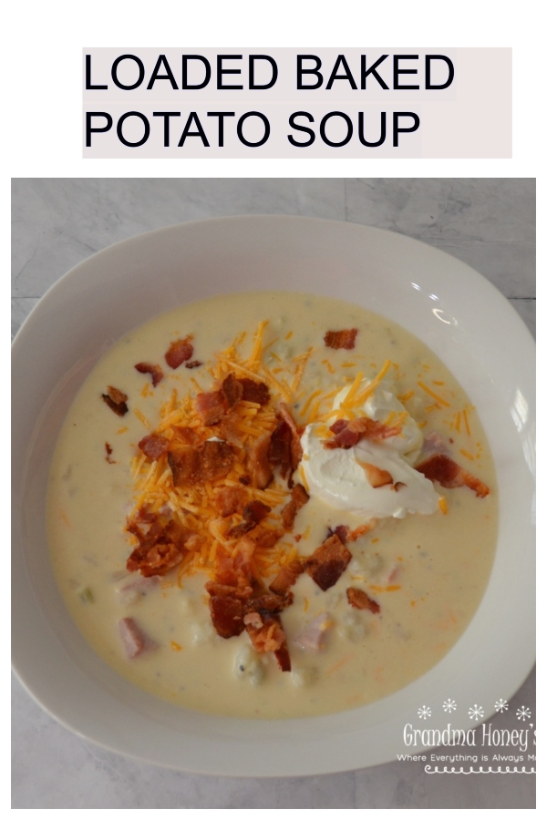 Loaded Baked Potato Soup, a pot full of potatoes, ham, cheese, bacon and veggies.