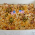 Firecracker Potato Casserole has Frozen Potatoes O Brien,  Rotel,  spicy sausage, sour cream, butter, jalapenos, and lots of cheese. Perfect for BBQ's.