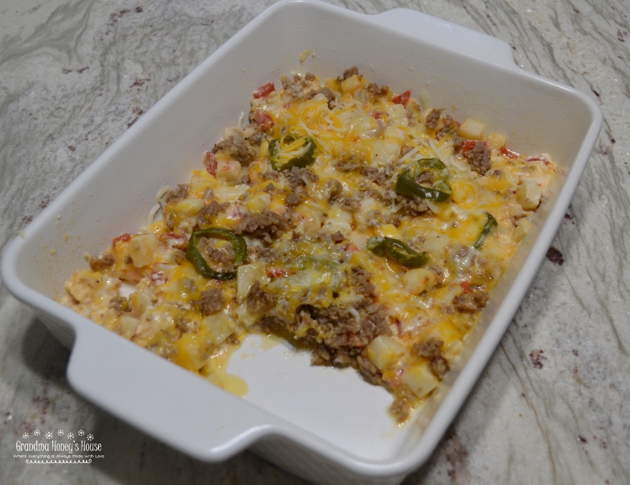 Firecracker Potato Casserole has Frozen Potatoes O Brien,  Rotel,  spicy sausage, sour cream, butter, jalapenos, and lots of cheese. Perfect for BBQ's.