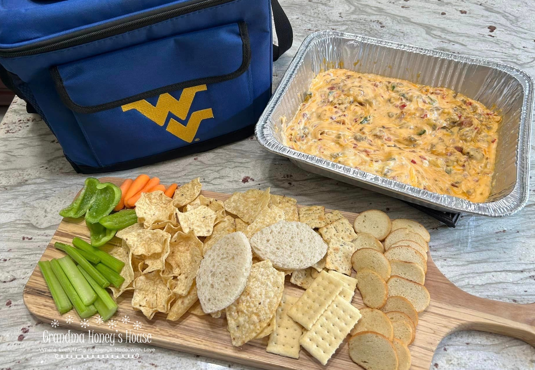 Smoky Sausage Pimento Cheese Dip is prepared on the grill and perfect for tailgates.