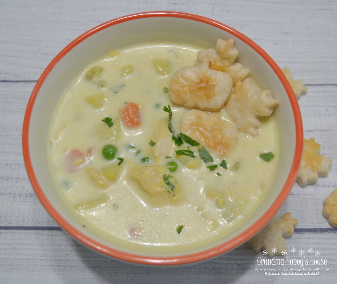 Chicken Pot Pie Soup loaded with chicken,veggies,a creamy broth and topped with herb flavored pie crust toppers.