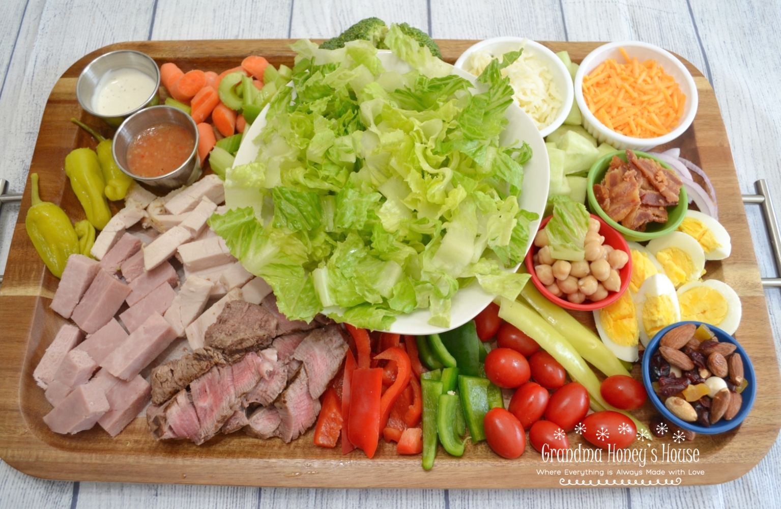 Super Chef Salad Served on a Board, Loaded with lettuce, veggies, meats and cheese. A complete meal.