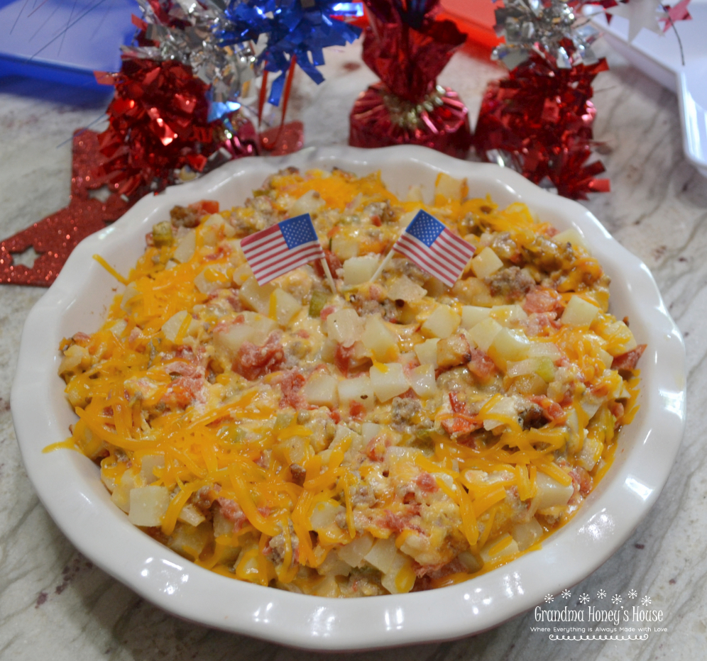 Firecracker Potato Casserole has Frozen Potatoes O Brien,  Rotel,  spicy sausage, sour cream, butter, jalapenos, and lots of cheese. Perfect for BBQ's.
