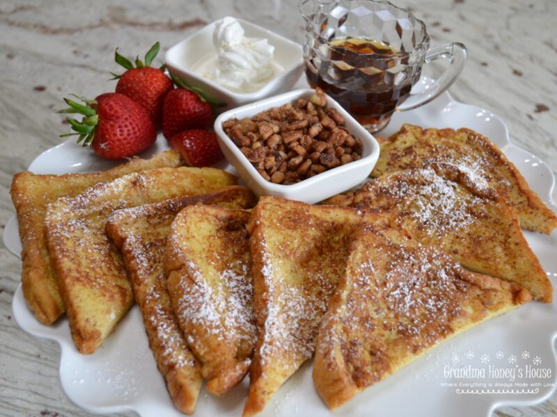 Thick slices of  brioche bread, soaked in a custard made of eggs, heavy cream, cinnamon, vanilla, nutmeg and salt, then fried in butter.  It is delicious served warm, with butter, syrup, confectioner sugar, and fresh fruit.