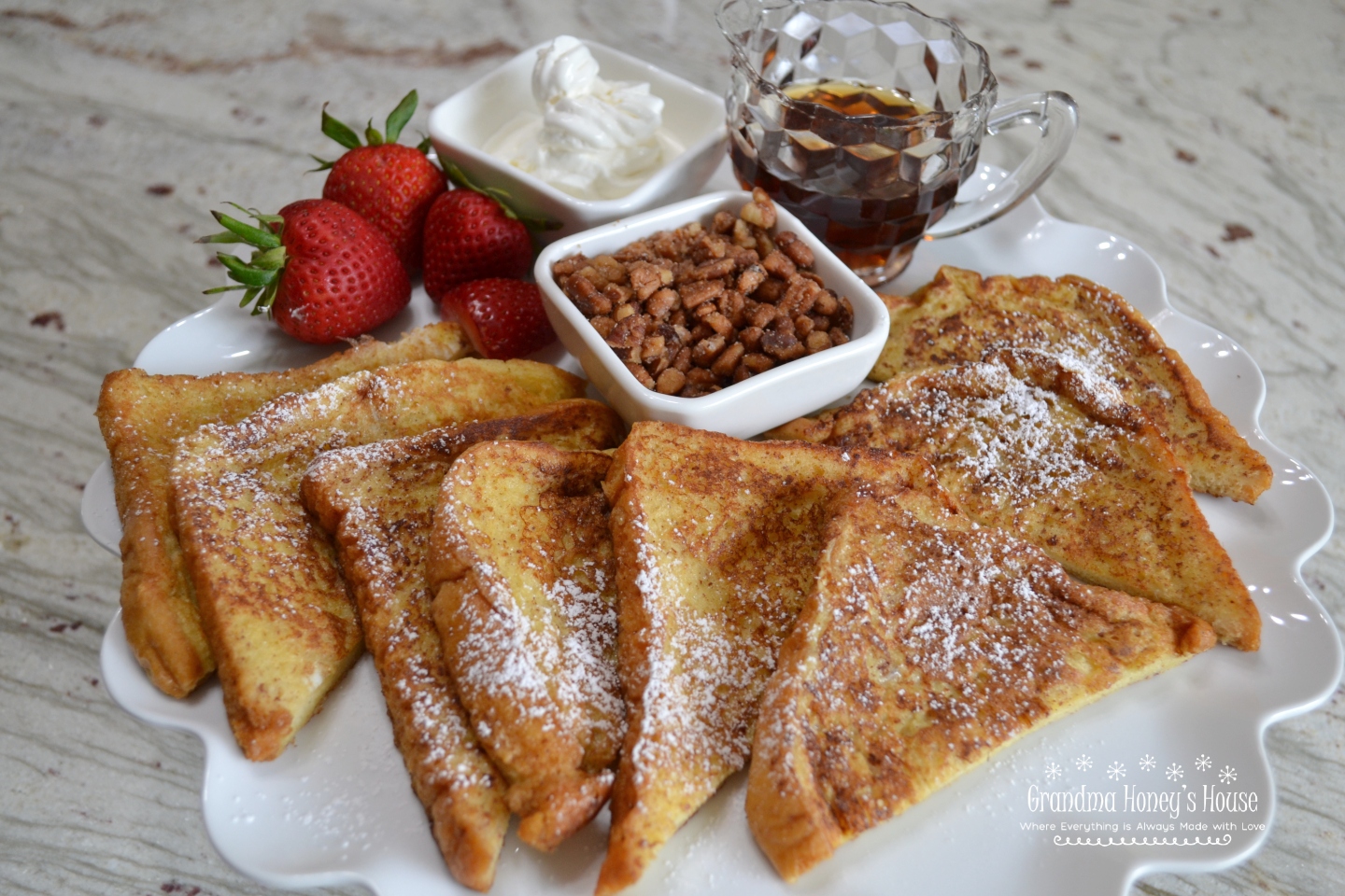 Homemade Eggnog French Toast, thick slices of  brioche bread, soaked in a custard made of eggs, heavy cream, cinnamon, vanilla, nutmeg and salt, then fried in butter.  It is delicious served warm, with butter, syrup, confectioner sugar, and fresh fruit.