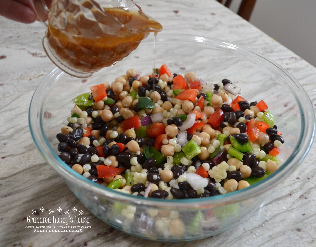 Black Bean and Corn Salad is perfect.  It is low fat, colorful, full of veggies, and is coated with a delicious red wine, garlic, and olive oil dressing.