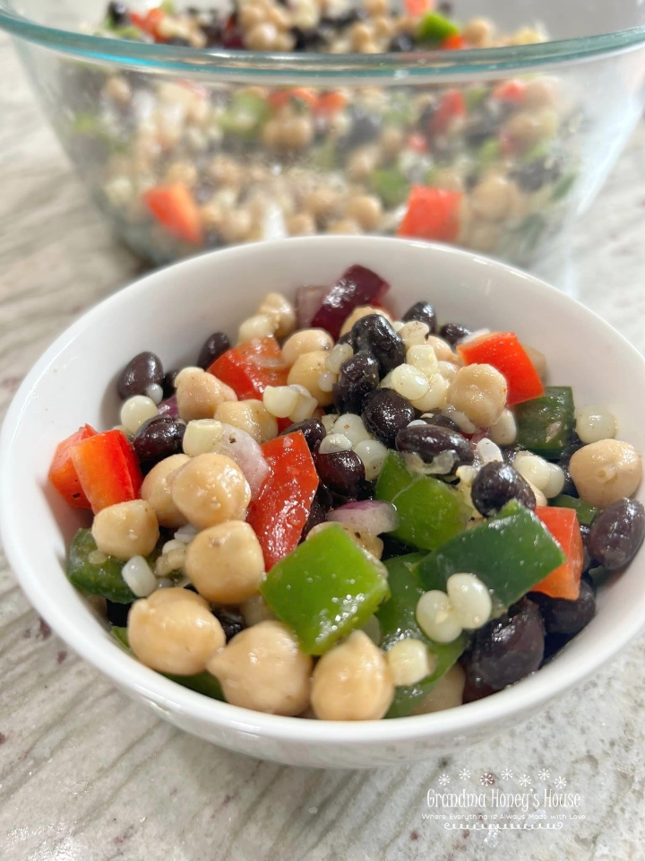 Black Bean and Corn Salad is perfect.  It is low fat, colorful, full of veggies, and is coated with a delicious red wine, garlic, and olive oil dressing.