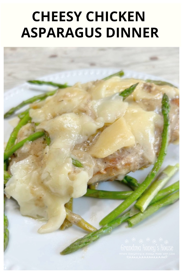 Cheesy Chicken Asparagus Dinner..pan fried chicken breasts, fresh asparagus, simmered in a white wine sauce and smothered with melted italian cheeses.