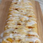 Peaches and Cream Crescent Braid...fresh peaches, cream cheese, sugar and cinnamon baked in a crescent  crust with a sweet glaze drizzled over it. 