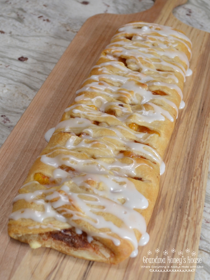 Bake about 20 minutes, or until crust is golden brown. Cool for 5 minutes then transfer to a serving platter. In a small bowl, stir together the confectioner sugar and a small amount of the milk until smooth and to obtain consistency to drizzle. (May add more confectioner sugar if too thin). Drizzle glaze over the crescent braid. 