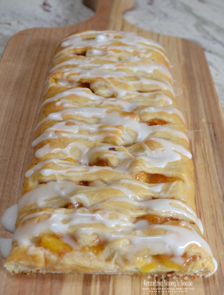 Peaches and Cream Crescent Braid...fresh peaches, cream cheese, sugar and cinnamon baked in a crescent  crust with a sweet glaze drizzled over it. 