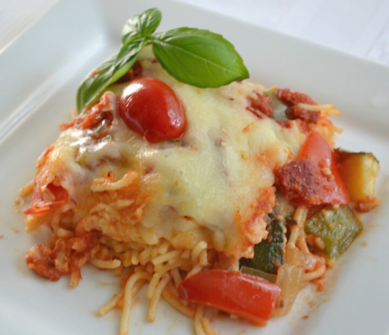 Cheesy Garden Patch Spaghetti bake is loaded with veggies, sauce, pasta and cheese. 