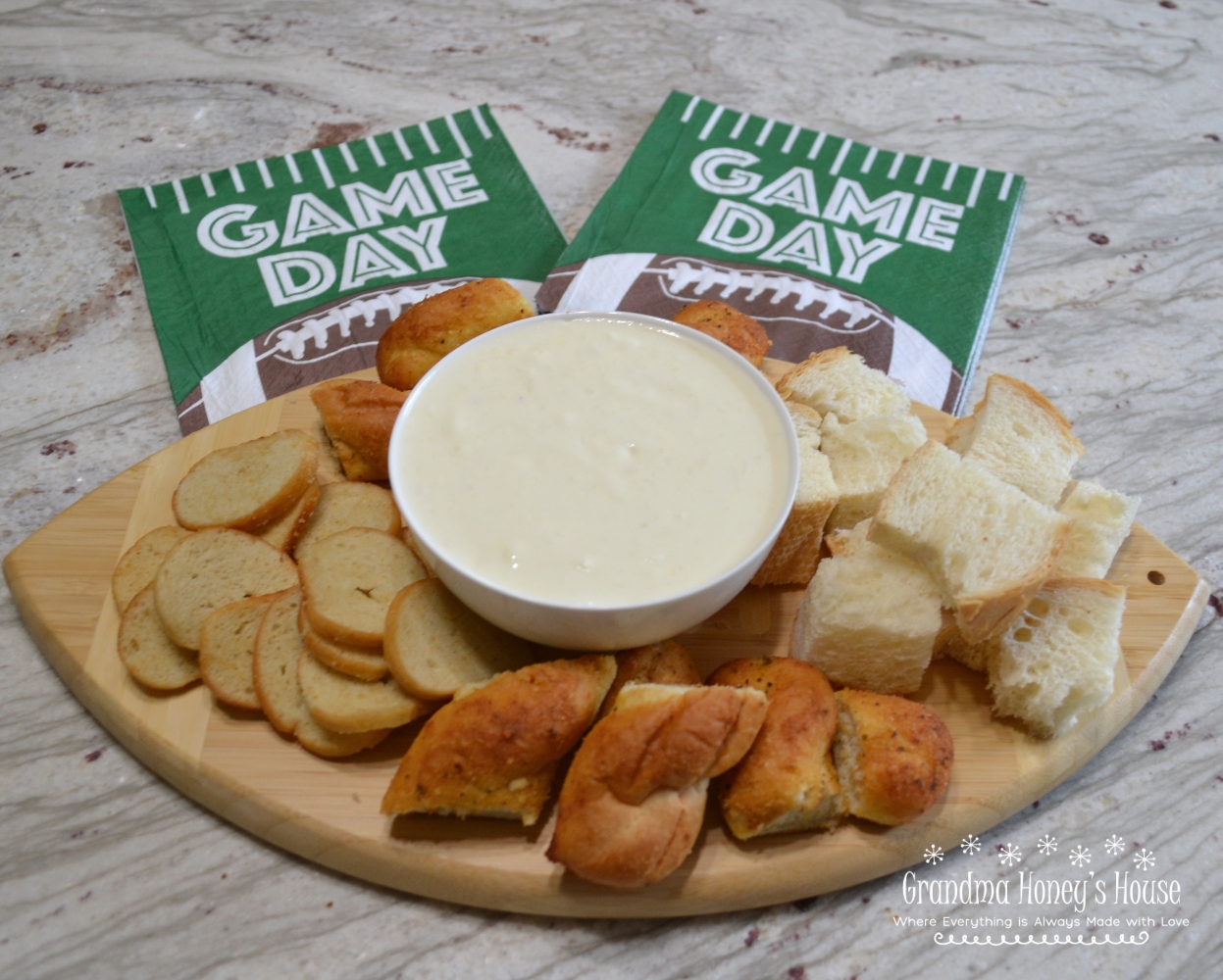 Garlic Parmesan Cheese Dip...a hot, creamy dip of melted cream cheese, minced garlic, whipping cream and parmesan cheese. Cubes of bread as dippers will make you think of a fondue. 