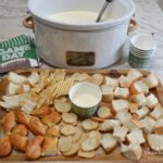 Garlic Parmesan Cheese Dip...a hot, creamy dip of melted cream cheese, minced garlic, whipping cream and parmesan cheese. Cubes of bread as dippers will make you think of a fondue. 