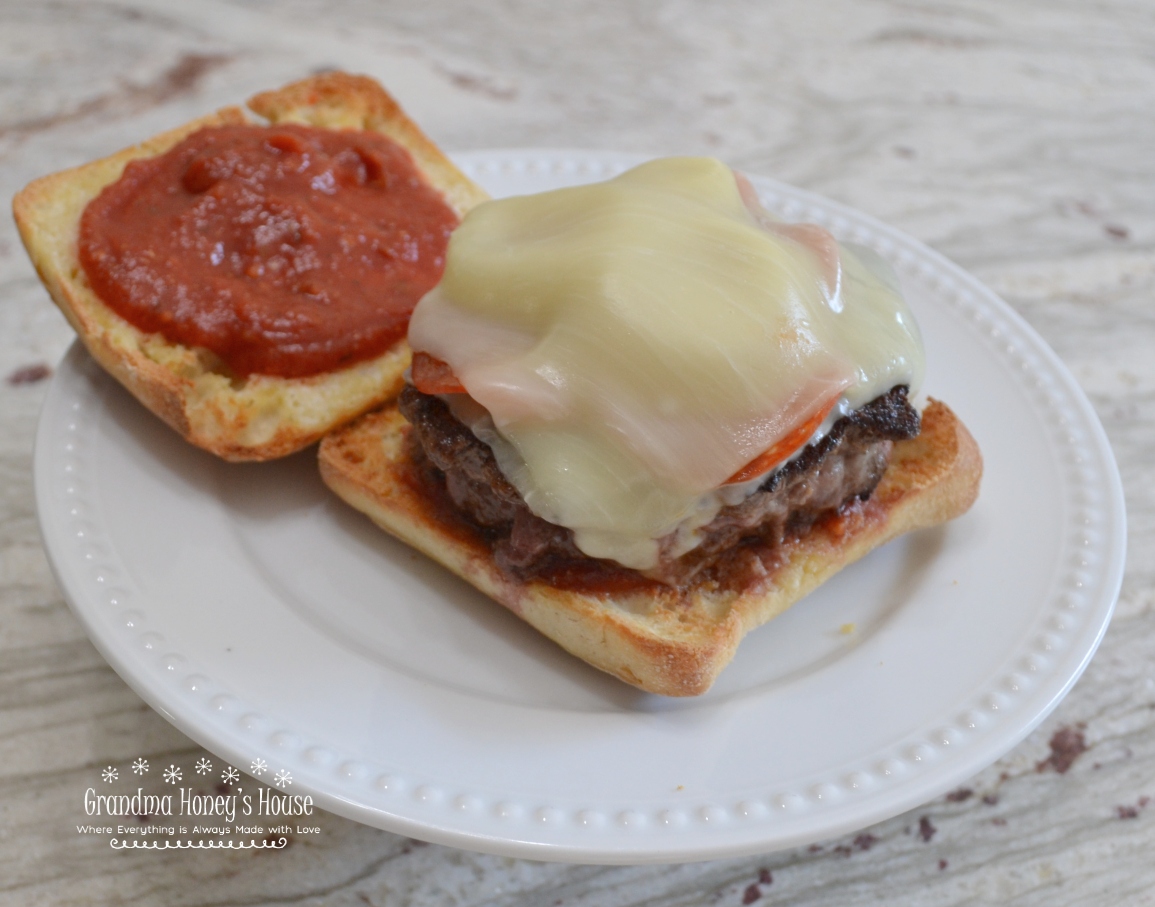 Pizza Burgers are seasoned ground beef patties, layered with mozzarella cheese, pepperoni, veggies, and topped with spoonfuls of warm pizza sauce. Serve on a garlic butter toasted bun.