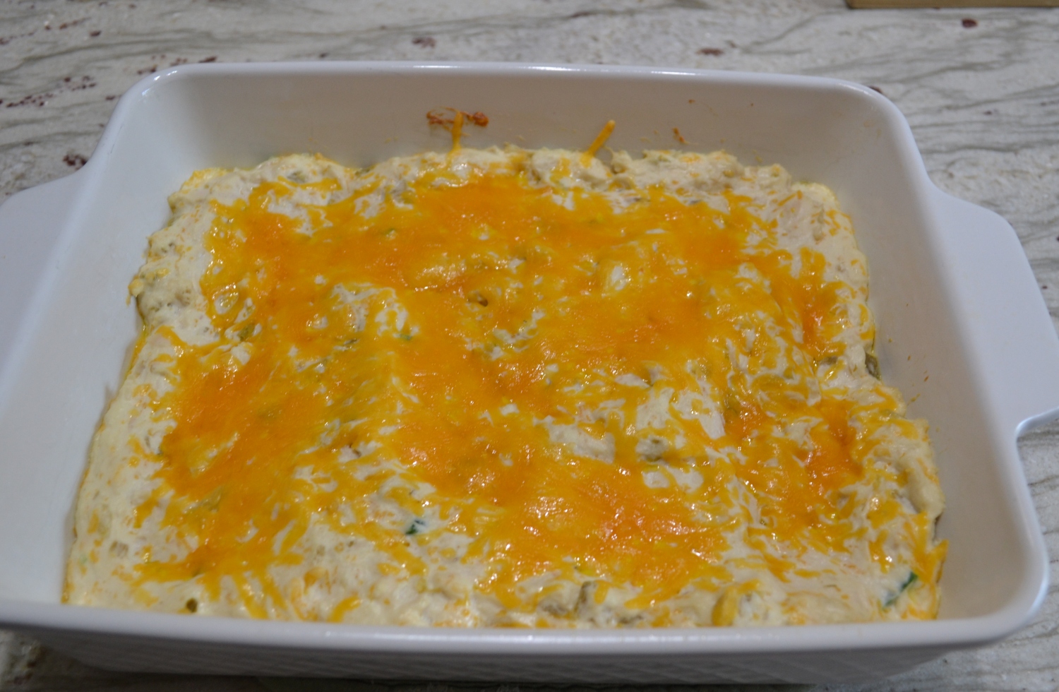 Cheesy Chicken Enchilada Dip is quick, creamy, hot dip loaded with cheeses, chicken, and a hit of heat.