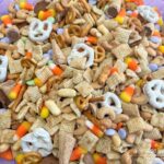 A combination of chex cereal, Gardetto's Original Snack Mix, cashews, yogurt pretzels, and a variety of candies make this Halloween Chex Mix the perfect treat. 