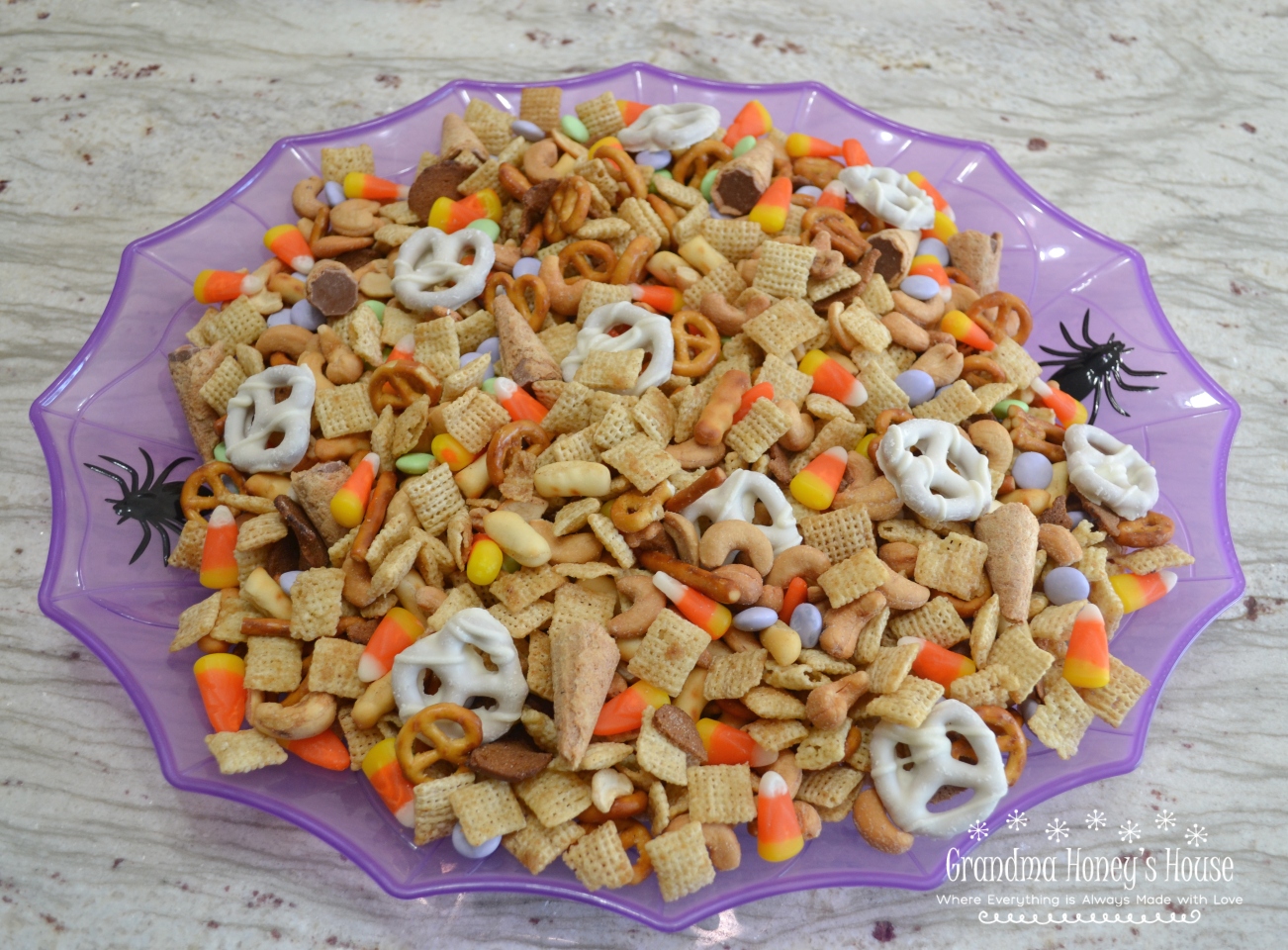 Halloween Chex Mix is a combination of sweet and salty treats, perfect for any party.