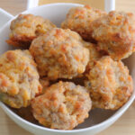 Bacon Cheddar Sausage Balls are a cheesy, savory appetizer made with sausage, cream cheese, cheddar cheese and a bacon cheddar biscuit mix.