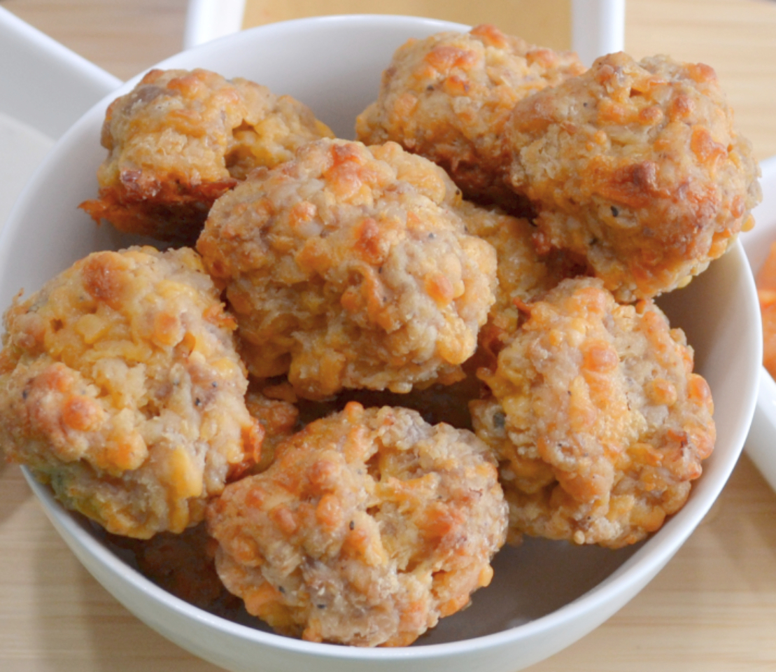 Bacon Cheddar Sausage Balls are a cheesy, savory appetizer made with sausage, cream cheese, cheddar cheese and a bacon cheddar biscuit mix.