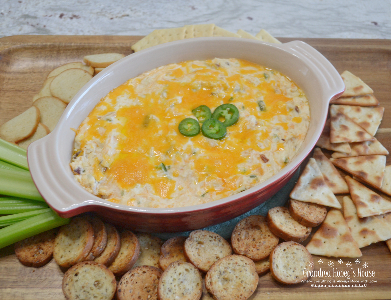 Rotisserie chicken, bacon, 2 kinds of cheese, fresh jalapenos, then baked, makes this Hot Chicken Jalapeno Dip the hit of any party