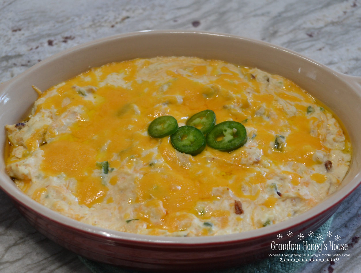 Rotisserie chicken, bacon, 2 kinds of cheese, fresh jalapenos, then baked, makes this Hot Chicken Jalapeno Dip the hit of any party.