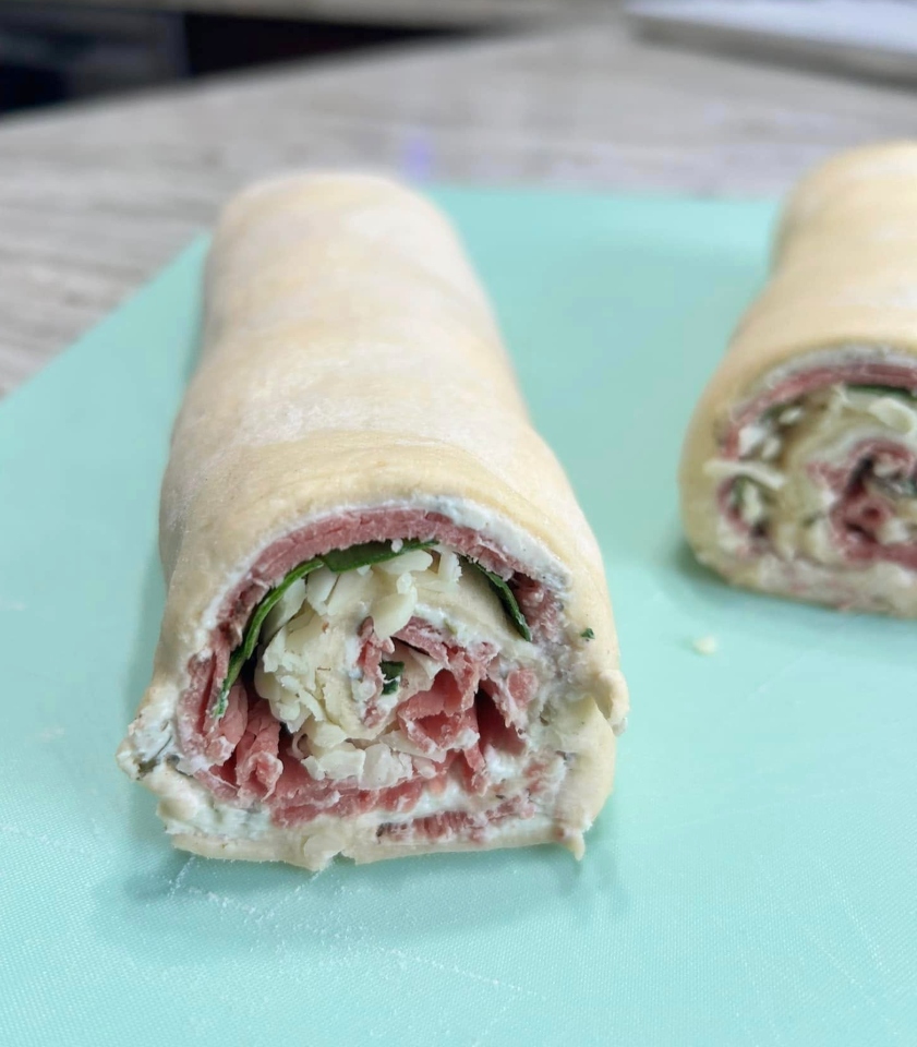 An easy, cheesy, appetizer loaded with roast beef, garlic and herb spread, smoked cheddar, and spinach, then baked in a buttery crescent dough. So many flavors in this quick and easy to make appetizer. 