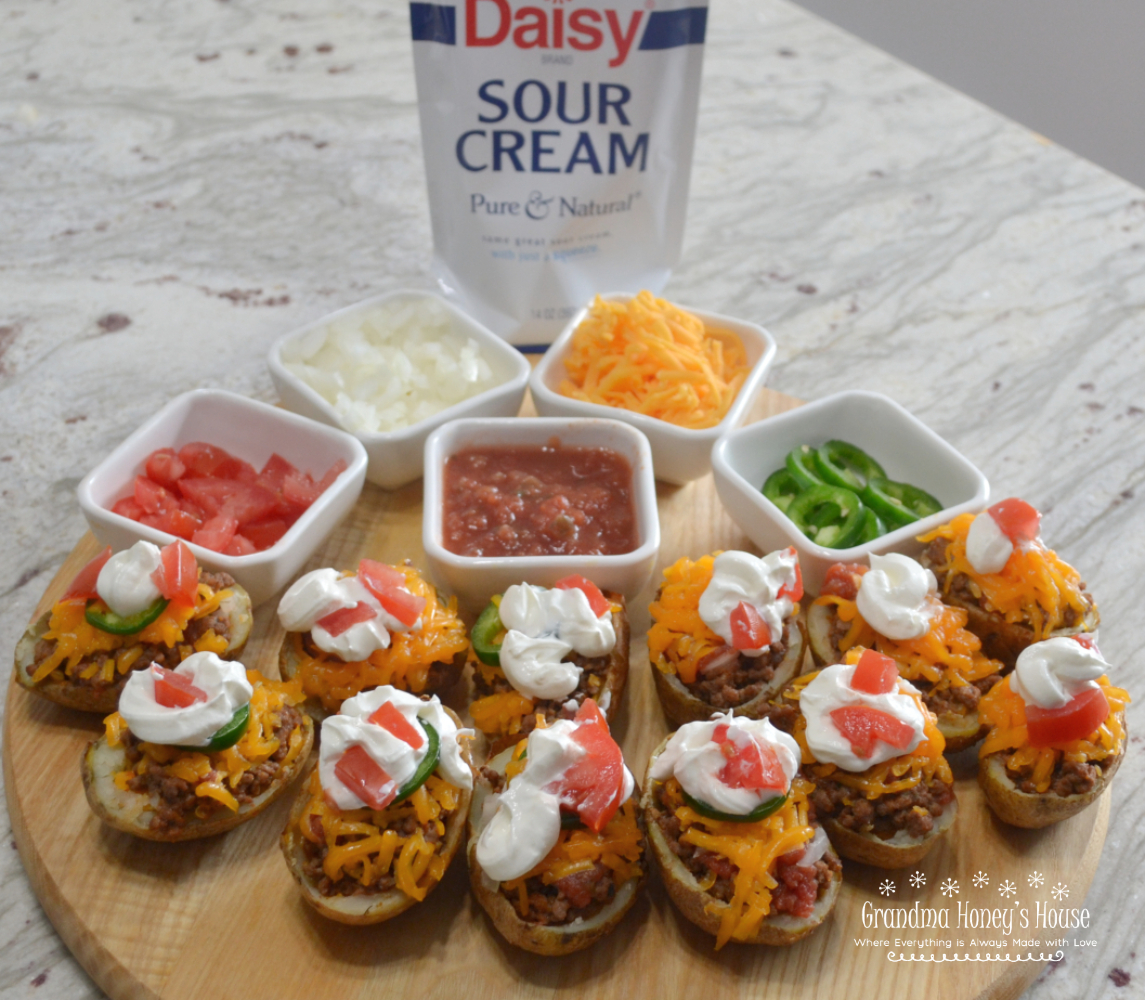 Southwestern Potato Skins are crispy oven baked potato skins loaded with taco meat, cheese, salsa, jalapenos and sour cream.