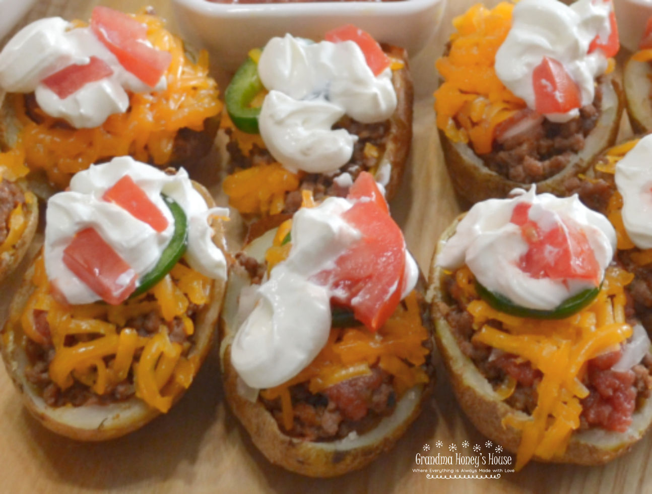 Southwestern Potato Skins are crispy oven baked potato skins loaded with taco meat, cheese, salsa, jalapenos and sour cream.