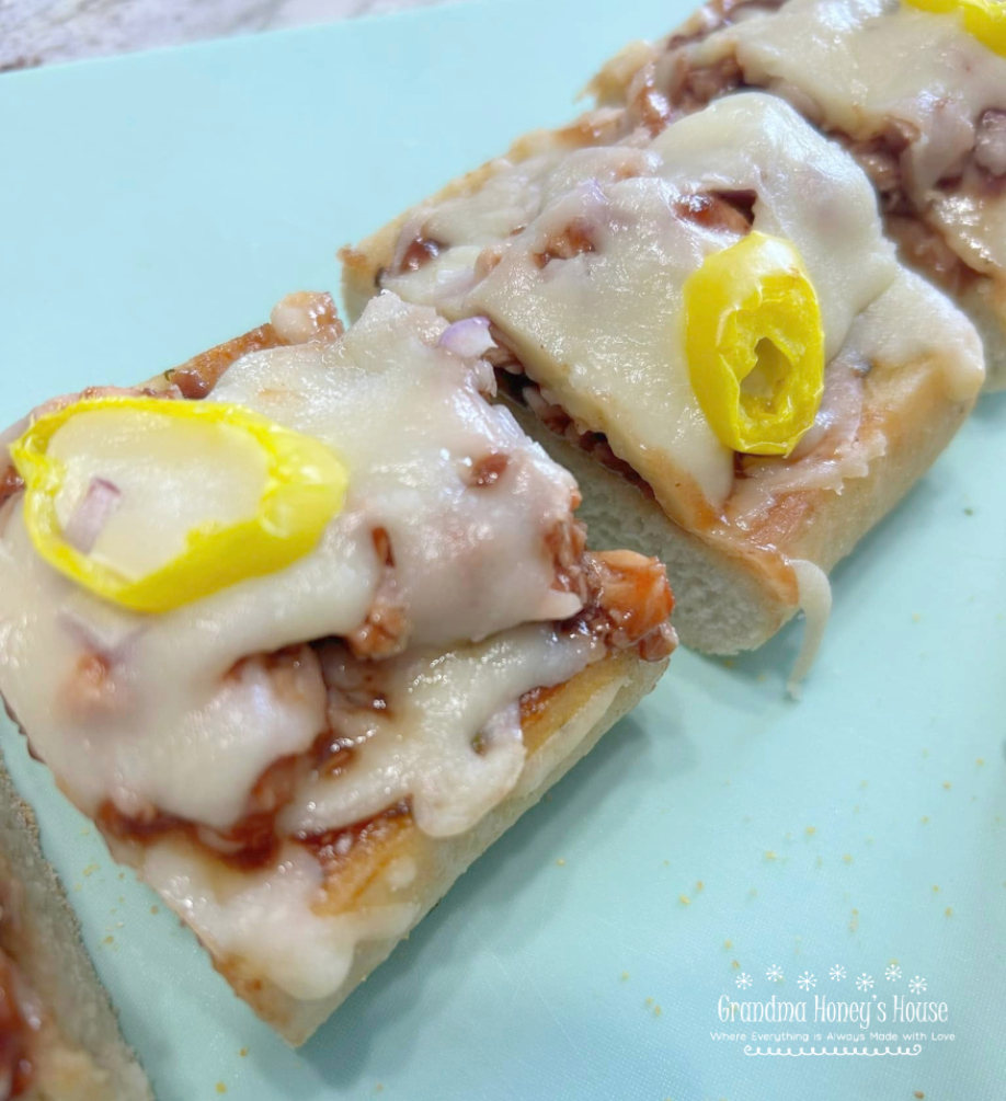 This BBQ Chicken Garlic Bread Pizza is the perfect quick dinner or after-school snack! Made with simple ingredients and ready in just 20 minutes.