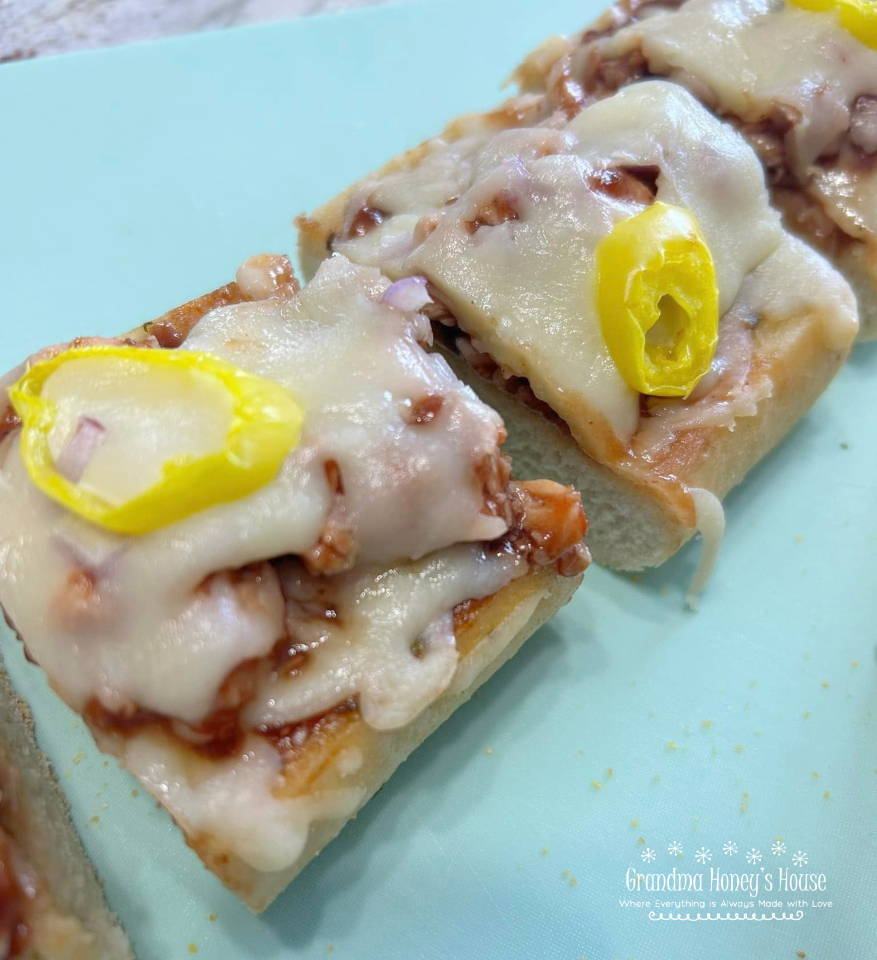 BBQ Chicken Garlic Bread Pizza ...frozen loaves of garlic bread, topped with  BBQ chicken, cheese, red onions, and banana peppers,  baked and ready to serve in minutes. 