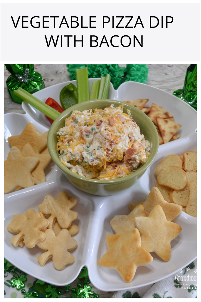 Vegetable Pizza Dip with bacon is a creamy dip made with cream cheese, sour cream, mayo, a Ranch dressing packet, a mixture of veggies, cheese and bacon.  It is served cold with a variety  of breads, crackers, chips, and celery sticks