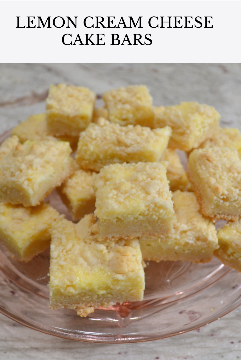 Easy cheesecake bars using a cake mix as a base, cream cheese and Lemon filling, topped with a crumble of the cake mix mixture.