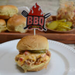 Pulled Pork Pimento Cheese Sliders. Tender, slow cooked pulled pork with warm, melted, spicy pimento cheese and served on a slider bun.