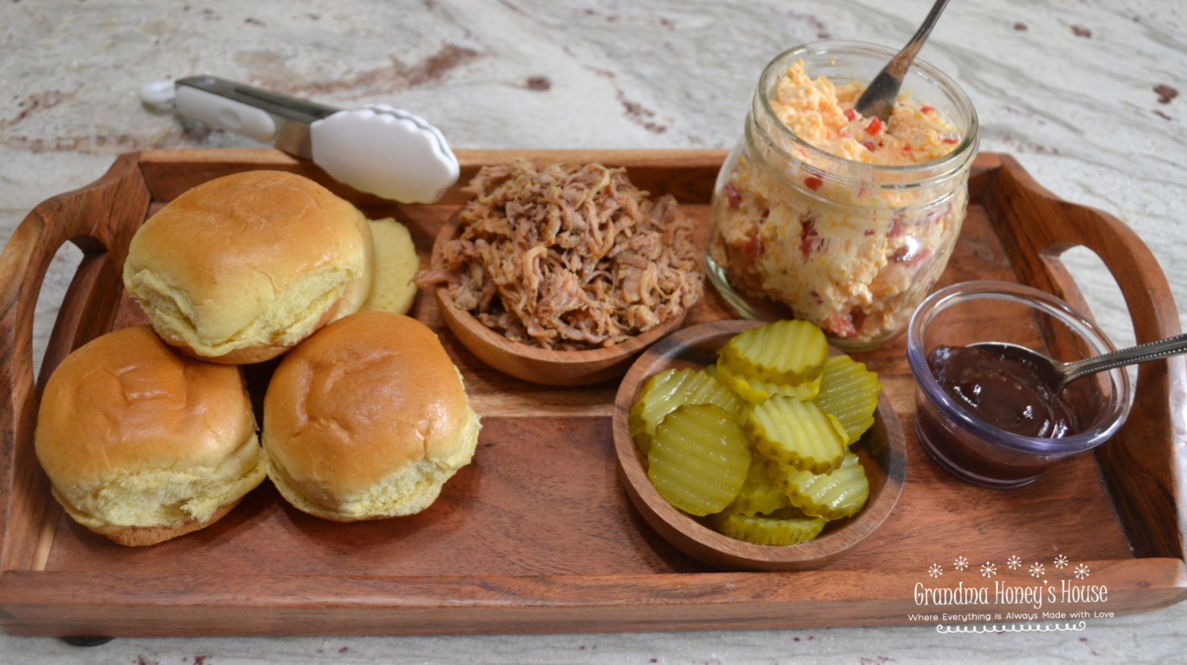 Pulled Pork Pimento Cheese Sliders. Tender, slow cooked pulled pork with warm, melted, spicy pimento cheese and served on a slider bun.