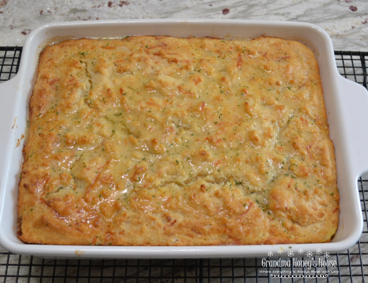 This hearty Sausage Cheddar Bay Breakfast Casserole will  become a family favorite, and one to make for special occasions. Loaded with sausage, peppers, onions and cheese, it is covered with a filling of eggs and half and half.  Top it all with a box of prepared Cheddar Bay Biscuit Mix and bake. 