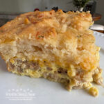 This hearty Sausage Cheddar Bay Breakfast Casserole will  become a family favorite, and one to make for special occasions. Loaded with sausage, peppers, onions and cheese, it is covered with a filling of eggs and half and half.  Top it all with a box of prepared Cheddar Bay Biscuit Mix and bake. 